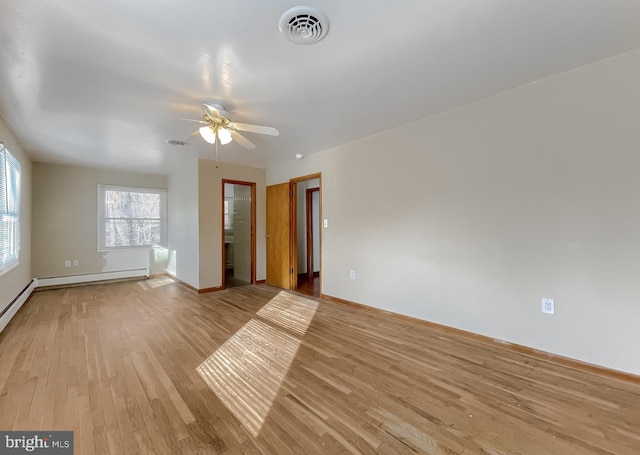 unfurnished room featuring light hardwood / wood-style flooring, ceiling fan, and a baseboard heating unit