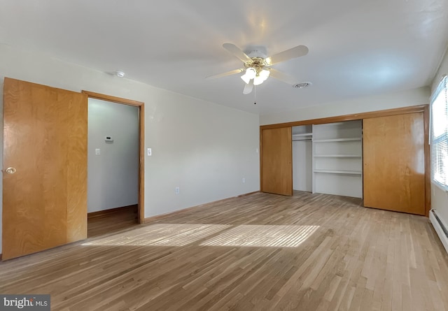 unfurnished bedroom featuring ceiling fan, light hardwood / wood-style floors, and a closet