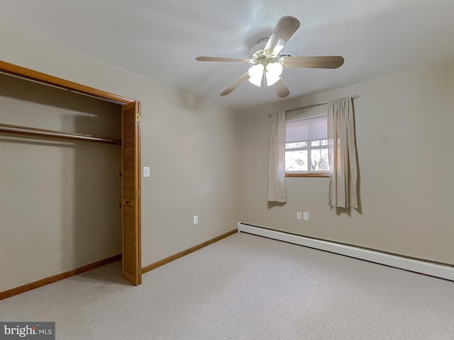 unfurnished bedroom featuring ceiling fan, a closet, carpet floors, and a baseboard radiator