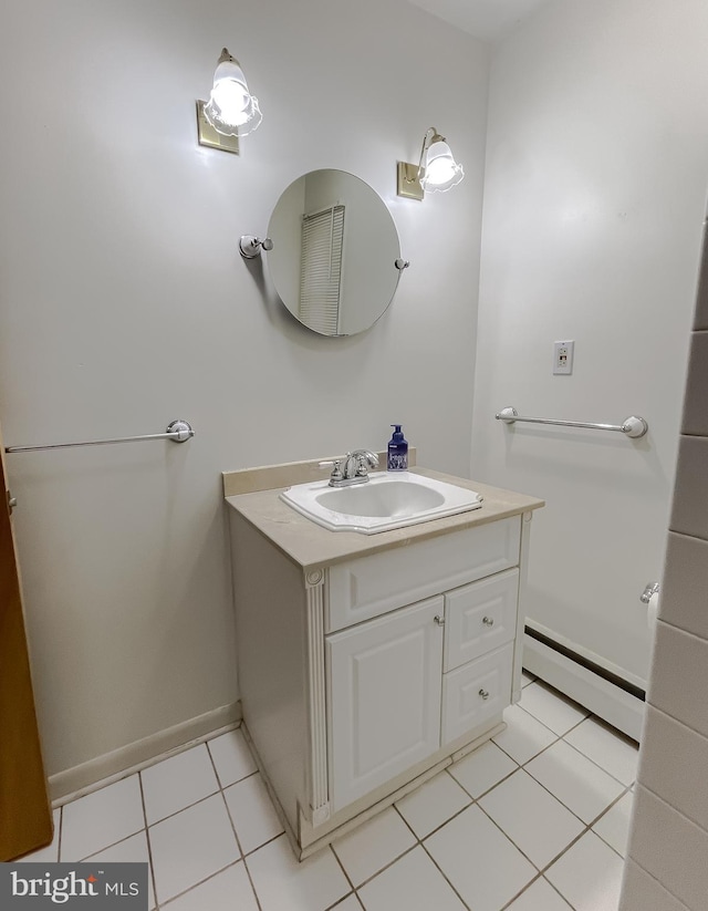 bathroom with tile patterned floors, vanity, and a baseboard heating unit