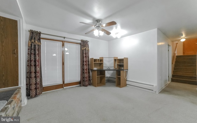 interior space featuring baseboard heating, light carpet, and ceiling fan