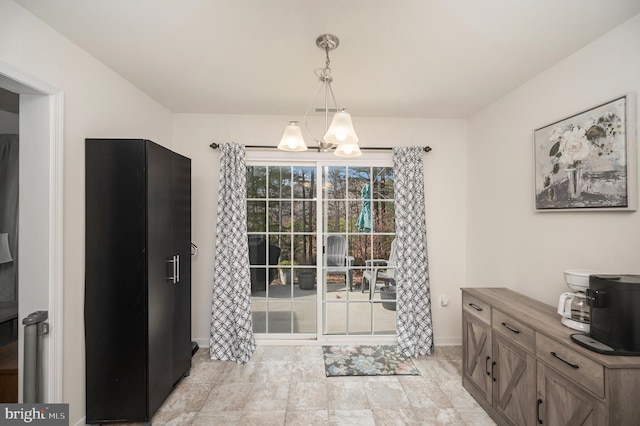 dining space with a notable chandelier