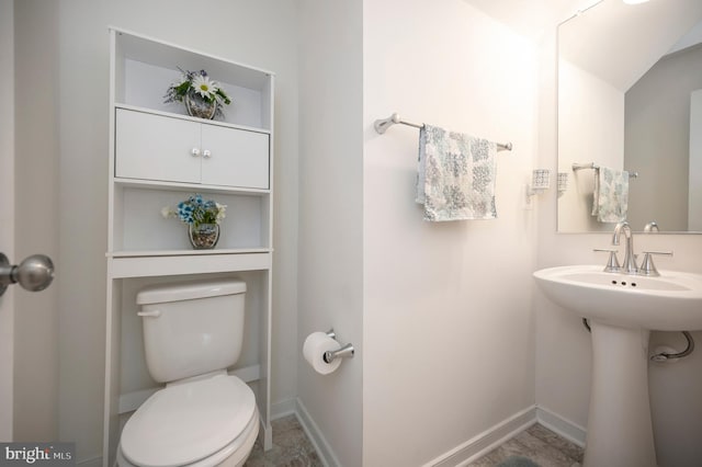 bathroom with toilet and sink