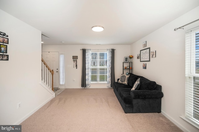 sitting room featuring carpet flooring and a wealth of natural light