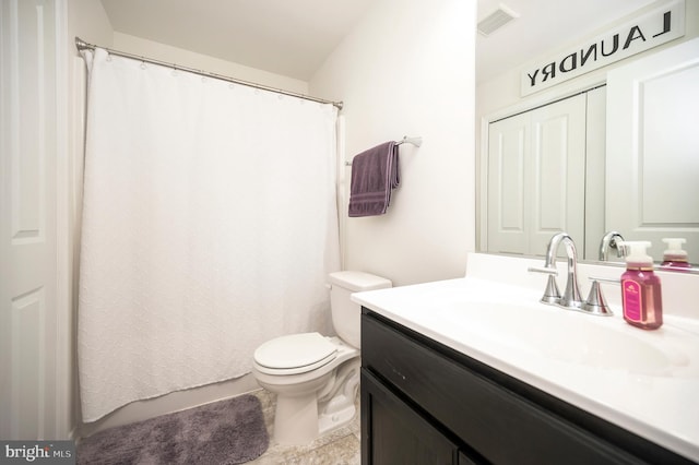 bathroom with vanity and toilet