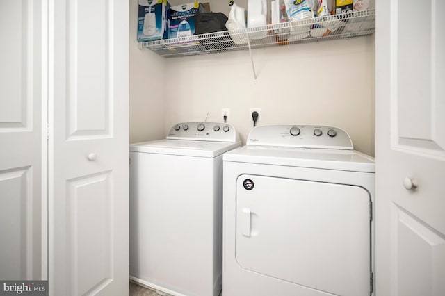 laundry room featuring washer and clothes dryer