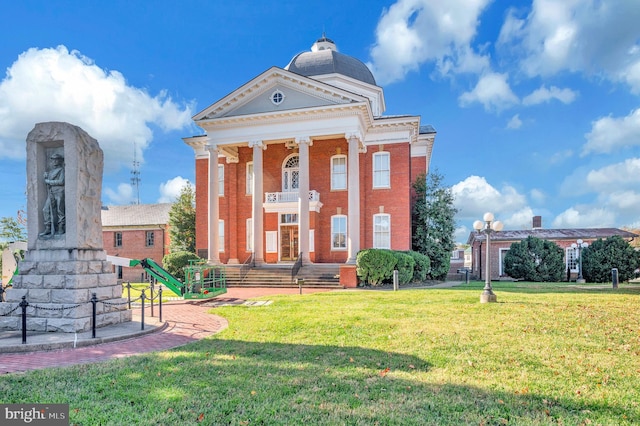 neoclassical / greek revival house with a front lawn