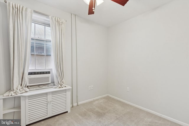 interior space featuring light carpet, ceiling fan, and cooling unit