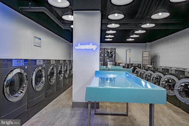 1901 John F Kennedy Blvd Unit 2305, Philadelphia, PA 19103 - community laundry with wood finished floors and concrete block wall