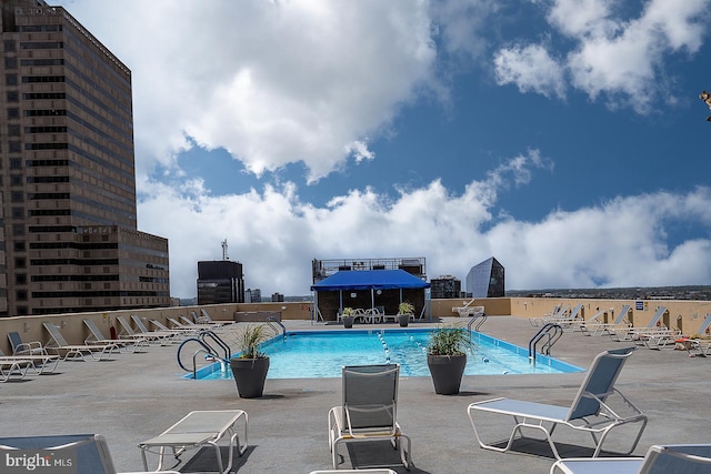 view of pool featuring a patio