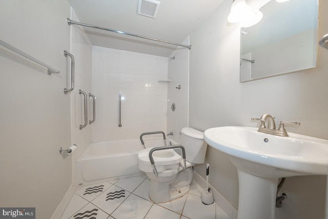 full bathroom featuring sink, tile patterned flooring, tiled shower / bath combo, and toilet