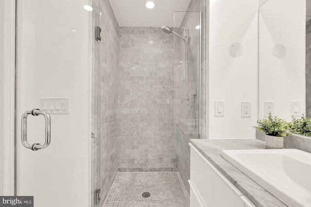 bathroom with vanity and walk in shower