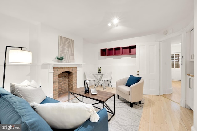 living room featuring hardwood / wood-style floors and a fireplace