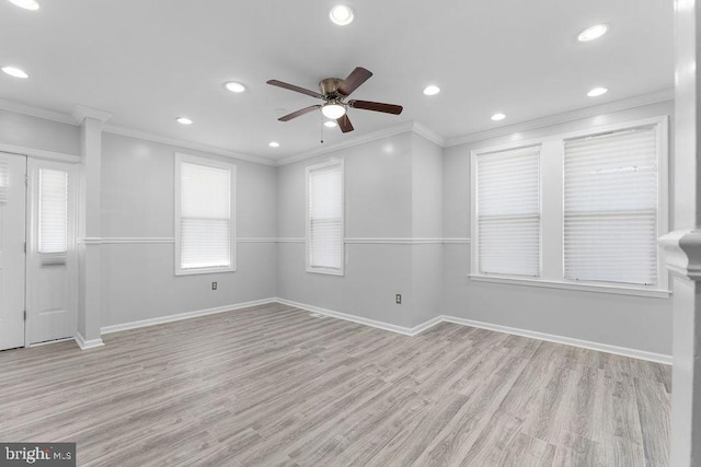 empty room with light hardwood / wood-style flooring, ceiling fan, and crown molding