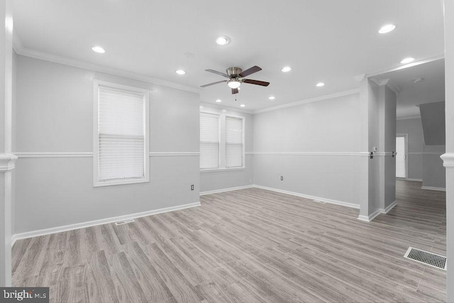 empty room featuring light hardwood / wood-style flooring, ceiling fan, and ornamental molding