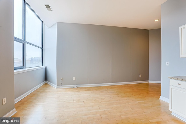 empty room with light wood-type flooring