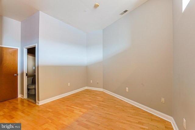 spare room featuring hardwood / wood-style flooring