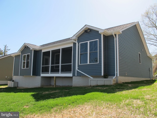 1240 Shore Dr, Colonial Beach, VA 22443 - rear view of property with a yard and a sunroom