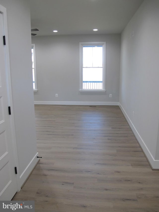 1240 Shore Dr, Colonial Beach, VA 22443 - spare room with baseboards, wood finished floors, and recessed lighting