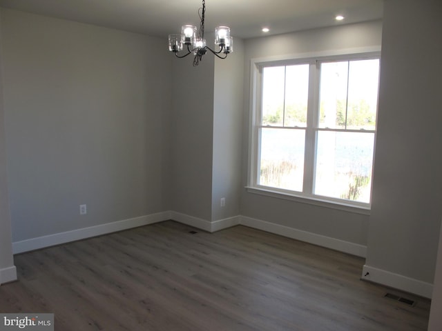 1240 Shore Dr, Colonial Beach, VA 22443 - spare room featuring a chandelier, wood finished floors, recessed lighting, and baseboards