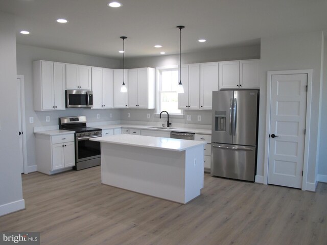 1240 Shore Dr, Colonial Beach, VA 22443 - kitchen featuring stainless steel appliances, a sink, light wood finished floors, and recessed lighting