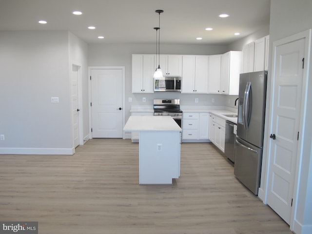1240 Shore Dr, Colonial Beach, VA 22443 - kitchen featuring stainless steel appliances, light wood finished floors, recessed lighting, white cabinets, and light countertops