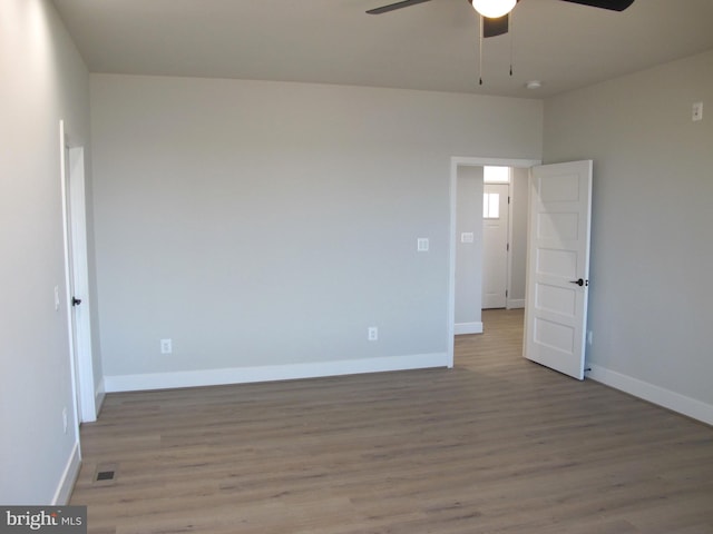 1240 Shore Dr, Colonial Beach, VA 22443 - unfurnished room with ceiling fan, wood finished floors, and baseboards