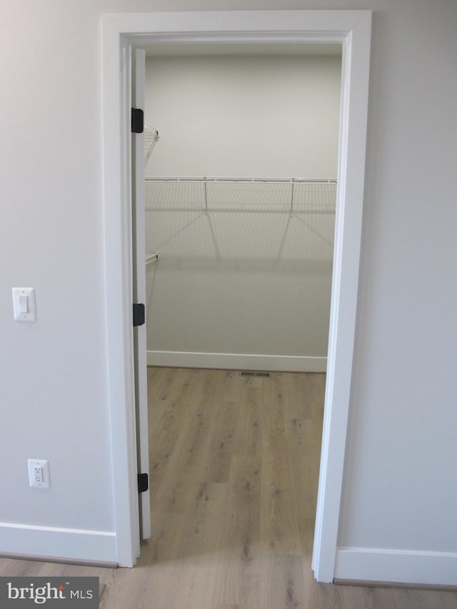 1240 Shore Dr, Colonial Beach, VA 22443 - walk in closet with wood finished floors