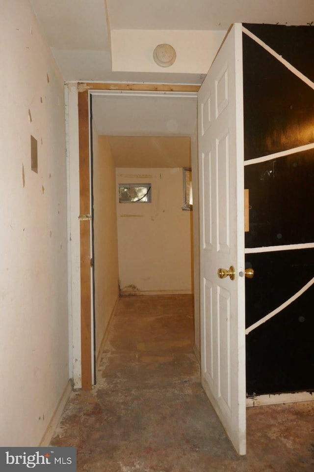 corridor with concrete flooring