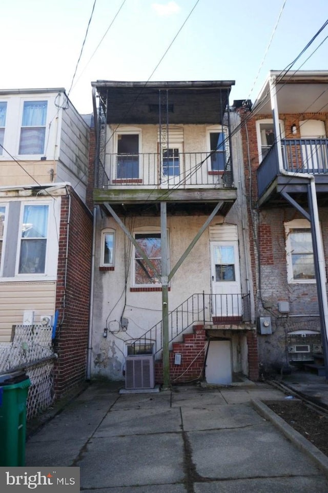 rear view of house with a balcony