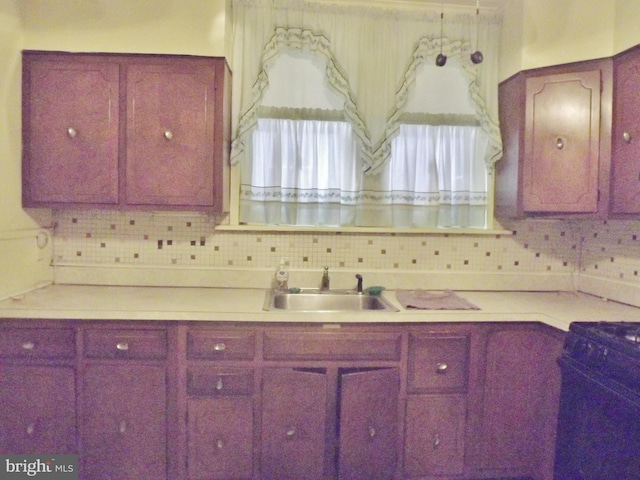 kitchen with tasteful backsplash and sink