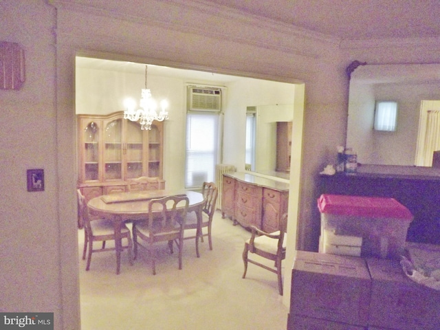 dining area featuring carpet floors, an inviting chandelier, a wall unit AC, and radiator