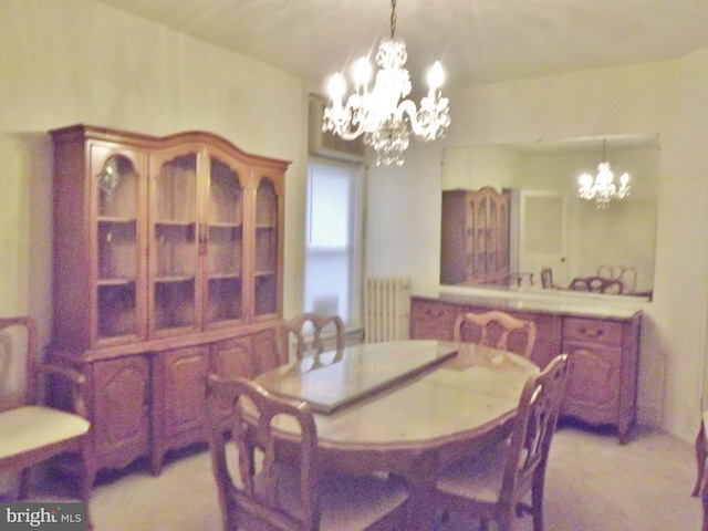 dining space featuring light colored carpet, radiator heating unit, and a chandelier