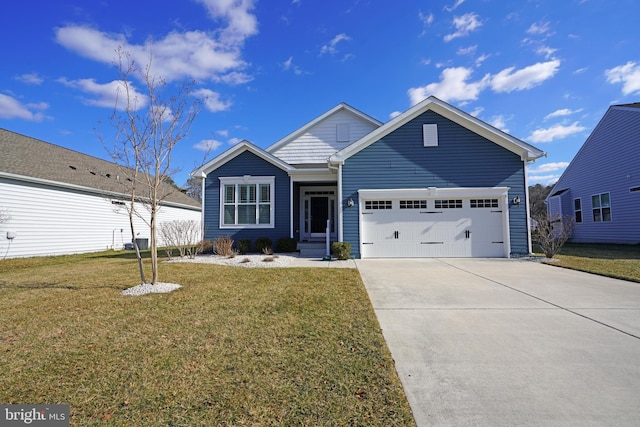 view of front facade with a garage and a front yard