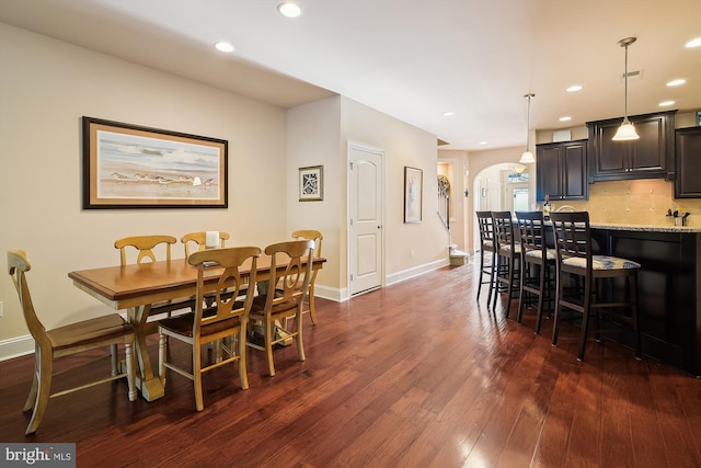 dining room with dark hardwood / wood-style flooring