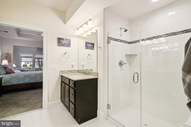 bathroom with tile patterned floors, vanity, and an enclosed shower