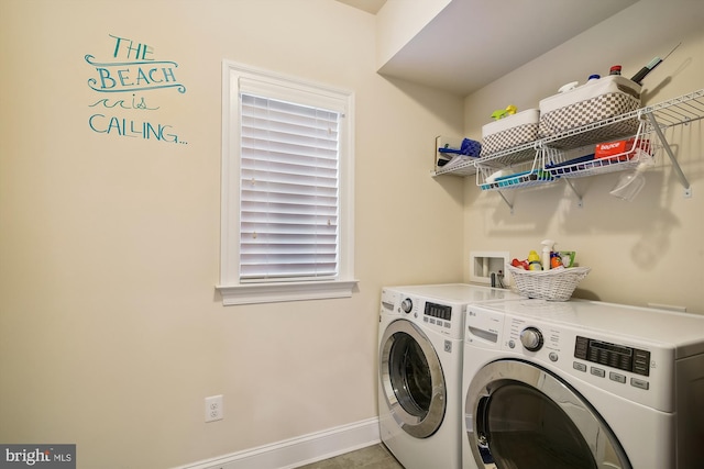 washroom with washing machine and dryer and tile patterned flooring