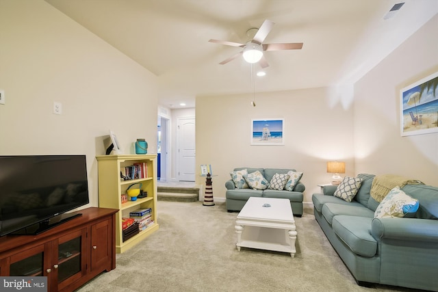 living room featuring ceiling fan and light carpet