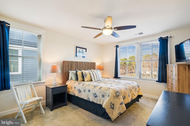 bedroom with light colored carpet and ceiling fan