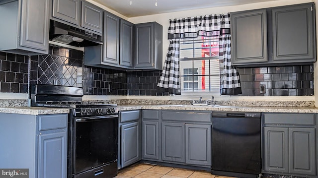 kitchen featuring black appliances, sink, gray cabinets, tasteful backsplash, and light tile patterned flooring