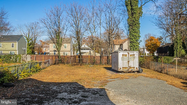 view of yard with a storage shed