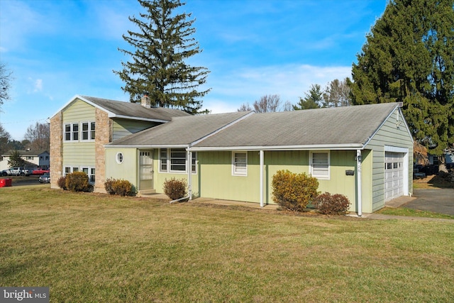 view of front facade with a front lawn and a garage