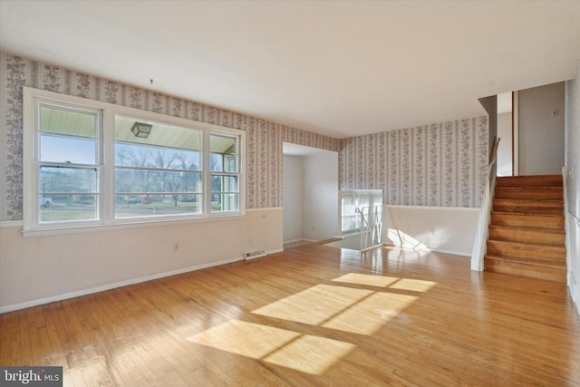 unfurnished living room with light wood-type flooring