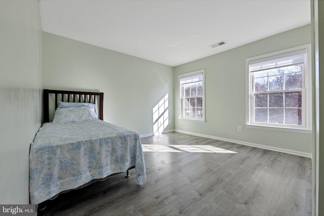 bedroom with hardwood / wood-style floors