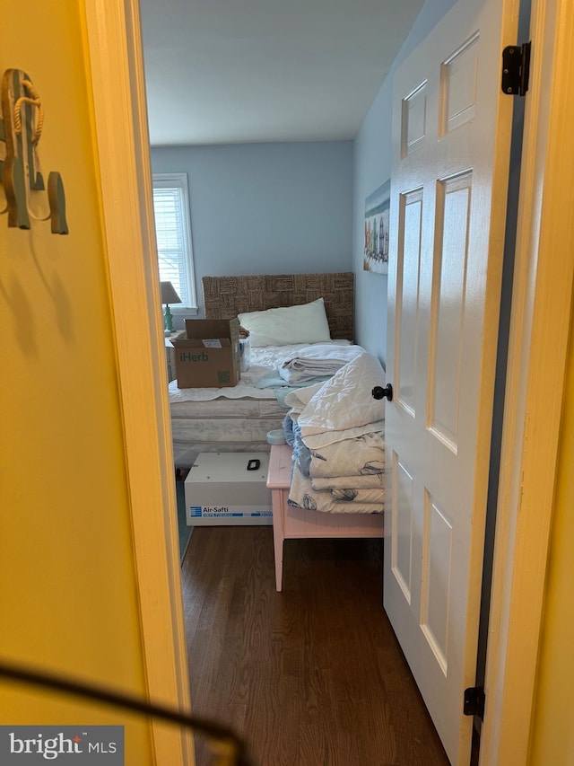 bedroom featuring dark hardwood / wood-style flooring