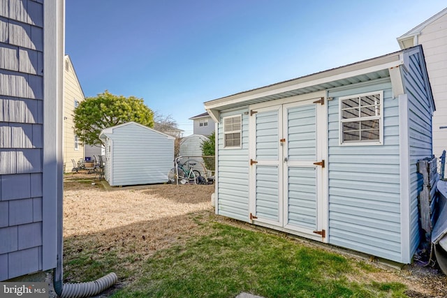 view of outbuilding with a lawn