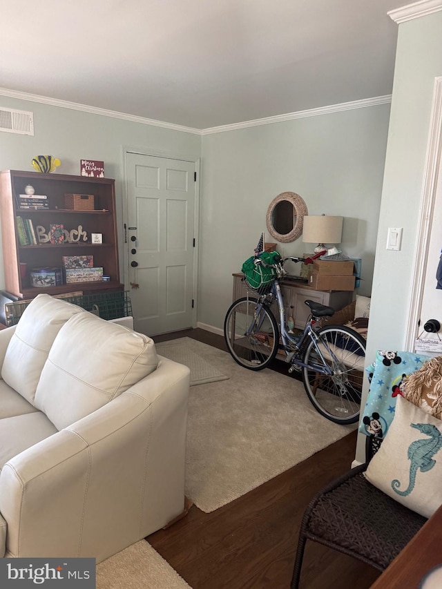 living room with dark hardwood / wood-style flooring and ornamental molding