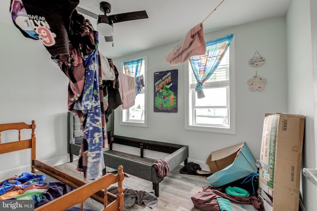 bedroom featuring ceiling fan and hardwood / wood-style flooring