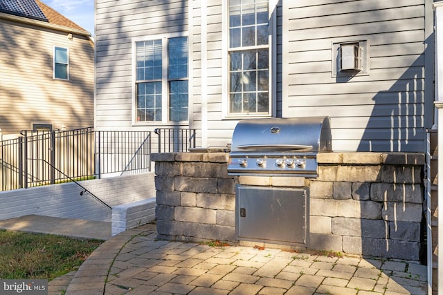 view of patio / terrace featuring an outdoor kitchen and area for grilling