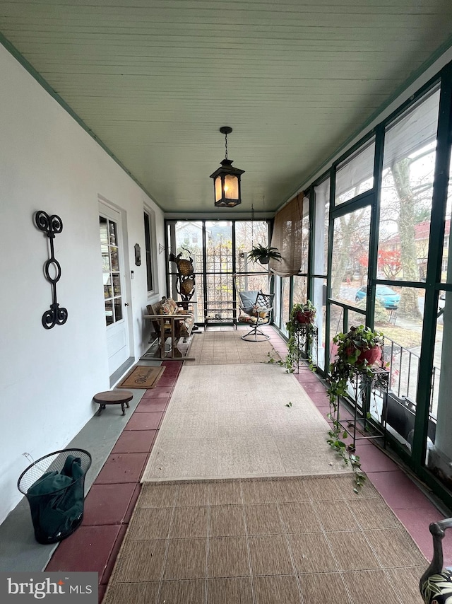 unfurnished sunroom with a healthy amount of sunlight